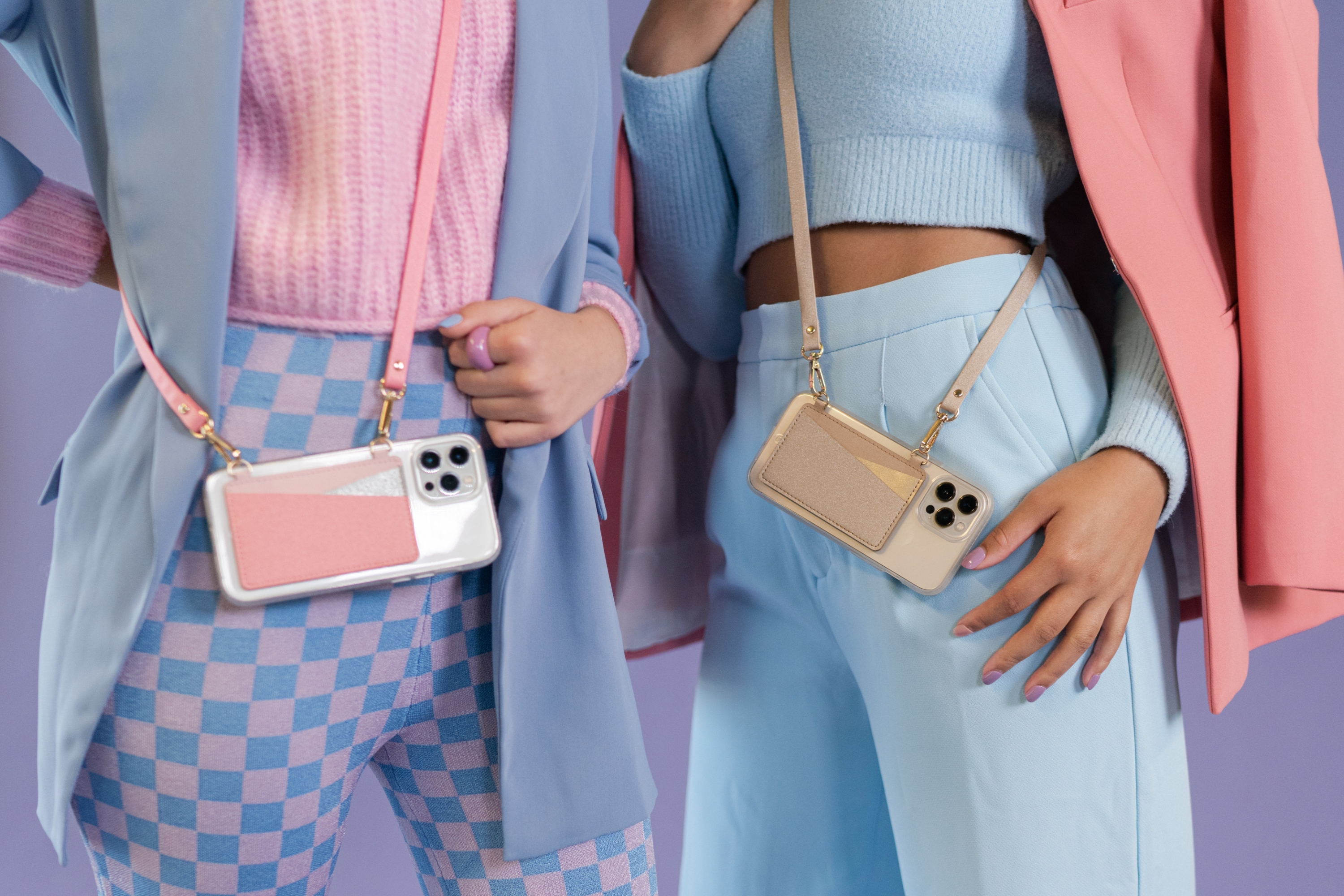 Two friends showing off MOXYO Crossbody Phone Wallet