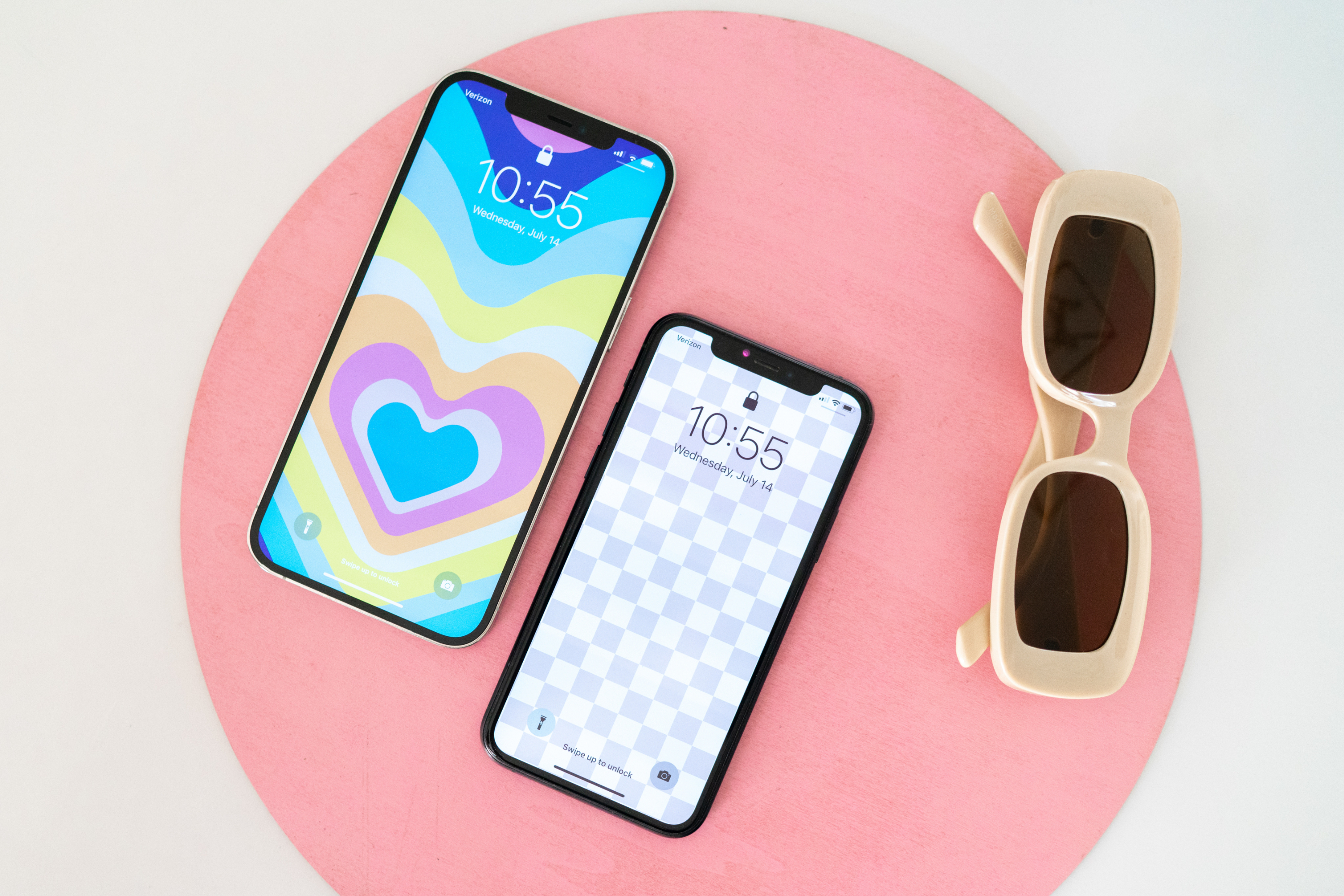 Phones with MOXYO wallpaper and sunglasses background